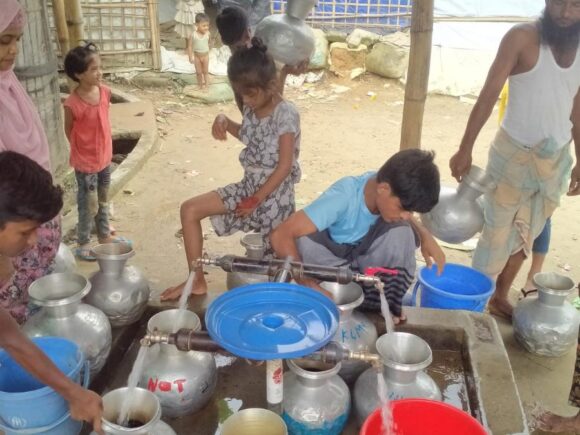 Mid Term Review of The Ekota project, under the DFAT-funded Bangladesh Rohingya and Host Community Humanitarian Package, supports Rohingya and host populations in Cox’s Bazar through protection, WASH, vocational training, and disaster risk reduction. Despite challenges, it reached 71,355 beneficiaries, focusing on inclusion and self-reliance. Consortium.